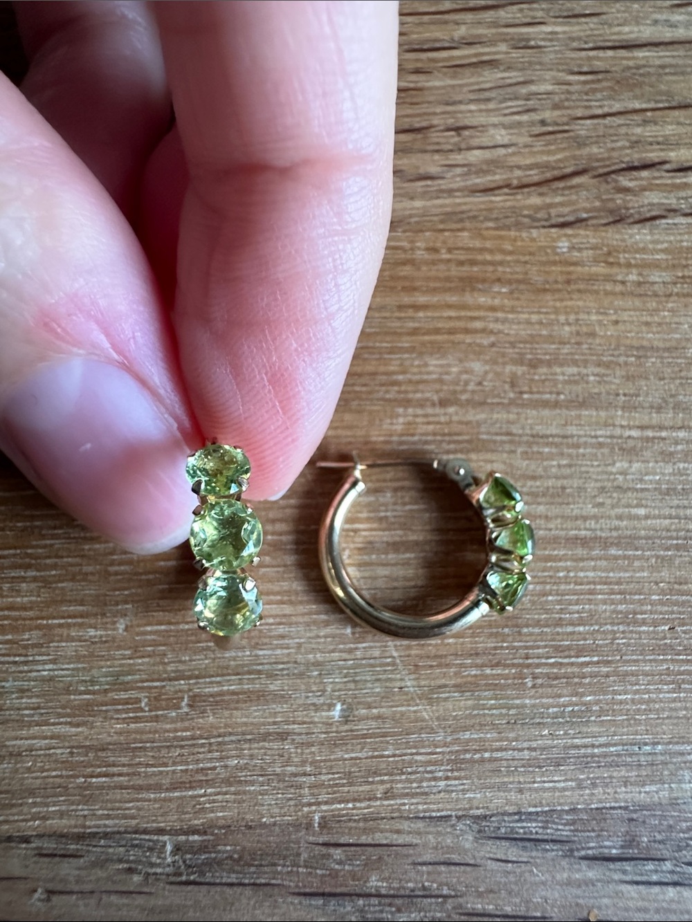 14k yellow gold huggie earrings with natural peridot stones
